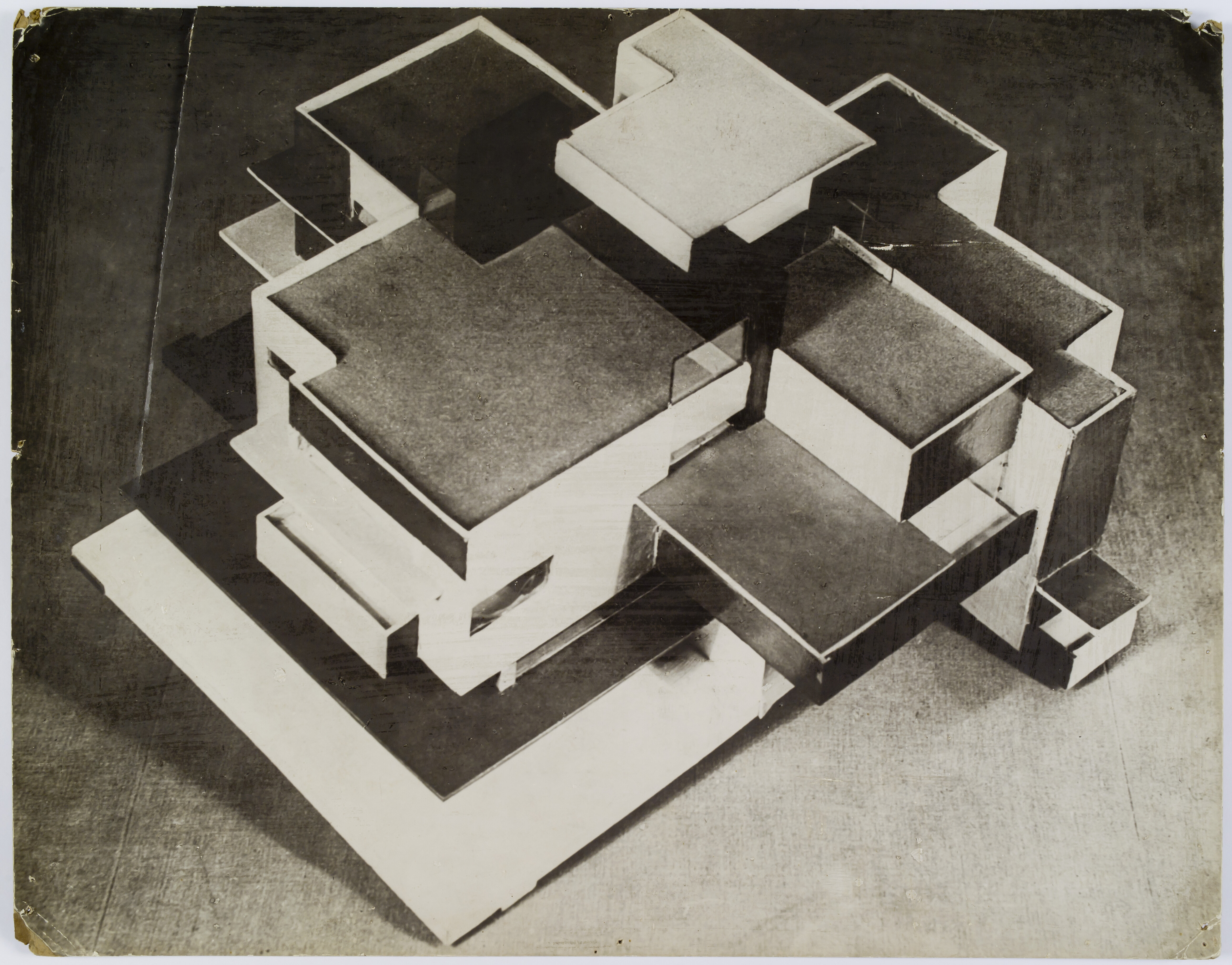 Black and white photograph showing a bird's eye view of a maquette of a residential building from the southeast.